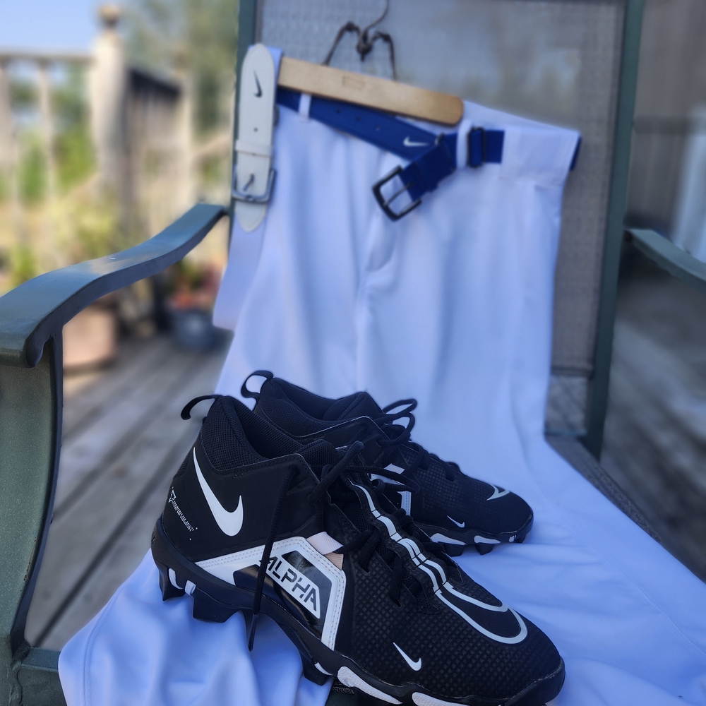 Nike Alpha Black Cleats with White Pants and Blue Belt